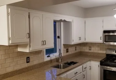 Finished white cabinet doors and drawers · Bloomington