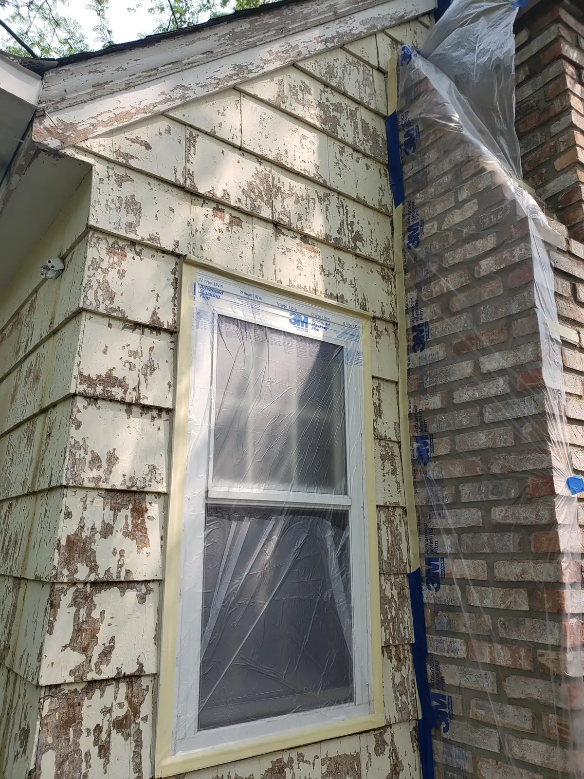 Side before: Exterior repaint (cedar shake and siding) · Minneapolis.
