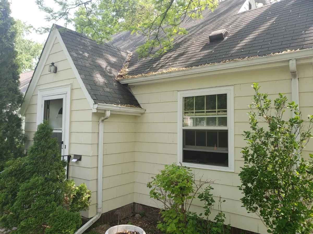 Front after: Exterior repaint (cedar shake and siding) · Minneapolis.