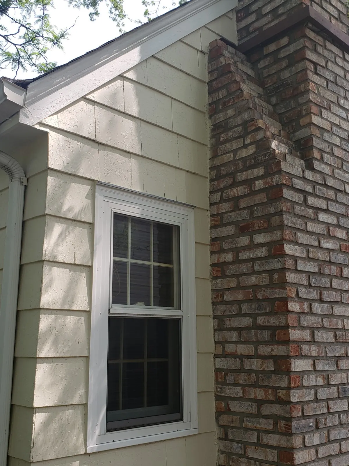 Side after: Exterior repaint (cedar shake and siding) · Minneapolis.
