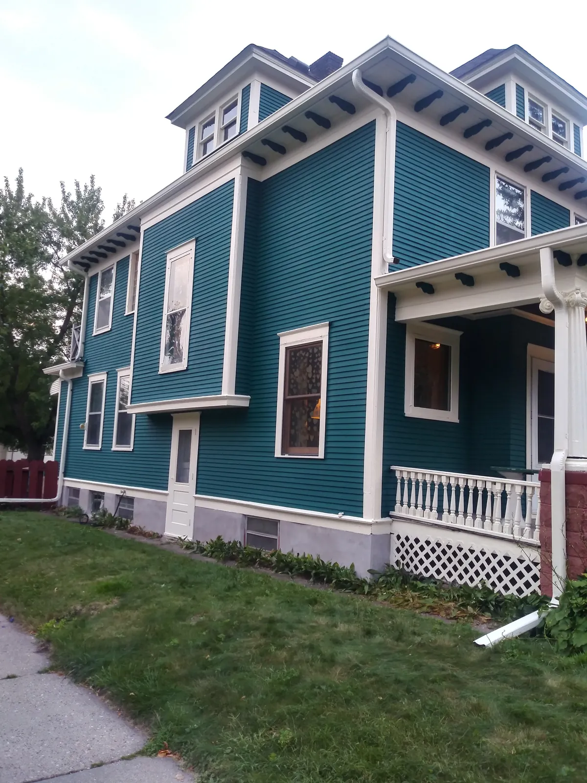 Side after: Exterior repaint (teal foursquare) · Minneapolis.
