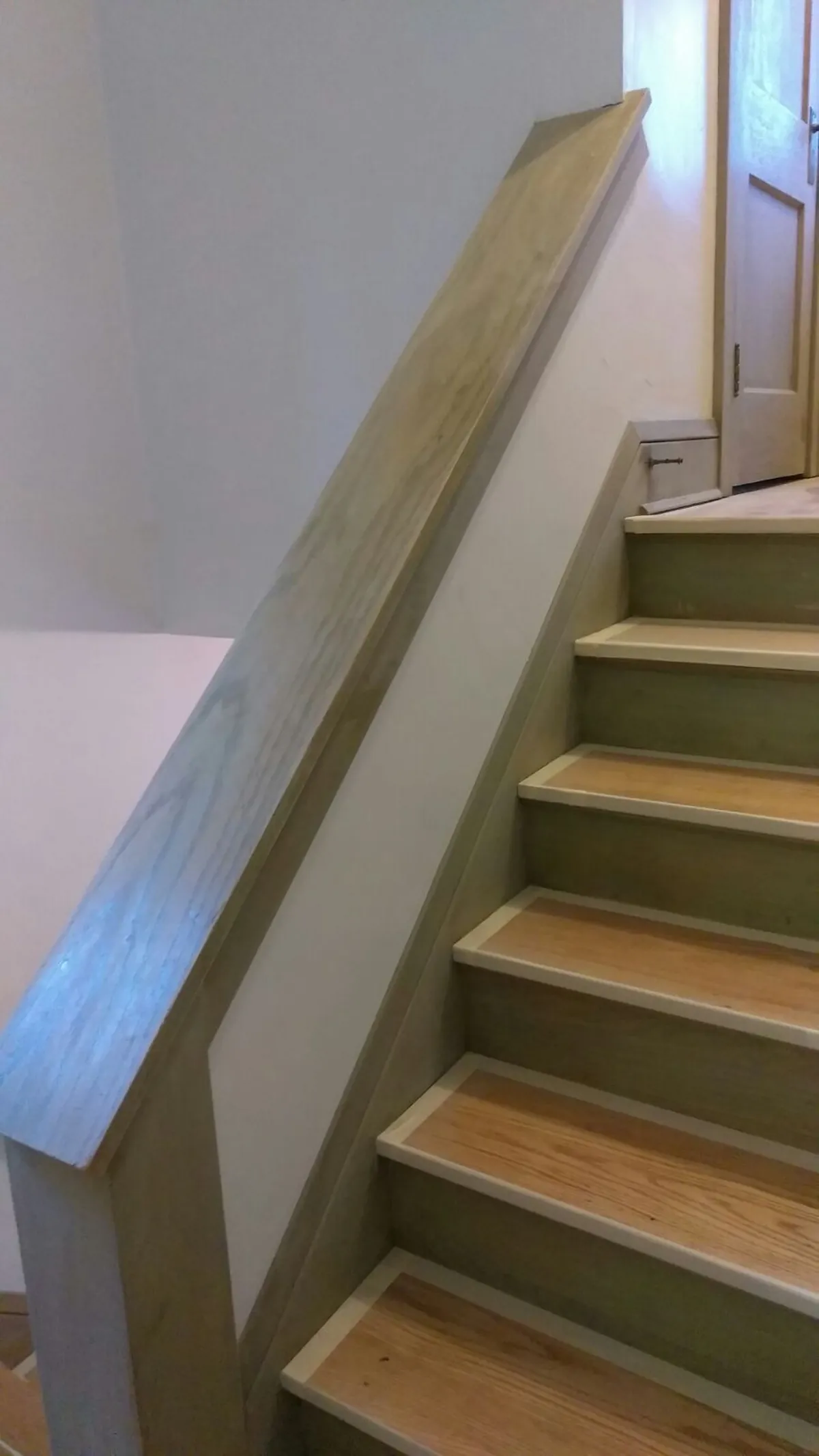 Stair trim preparation in progress: Trim enameling · Minneapolis.