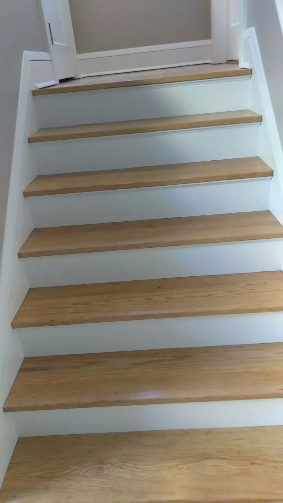 Finished white stair risers and trim: Trim enameling · Minneapolis.