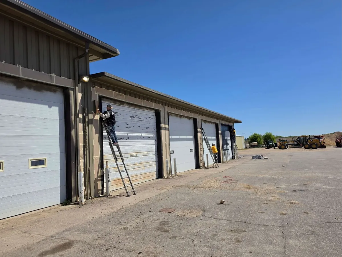 Before: whole maintenance hangar side exterior · Le Sueur