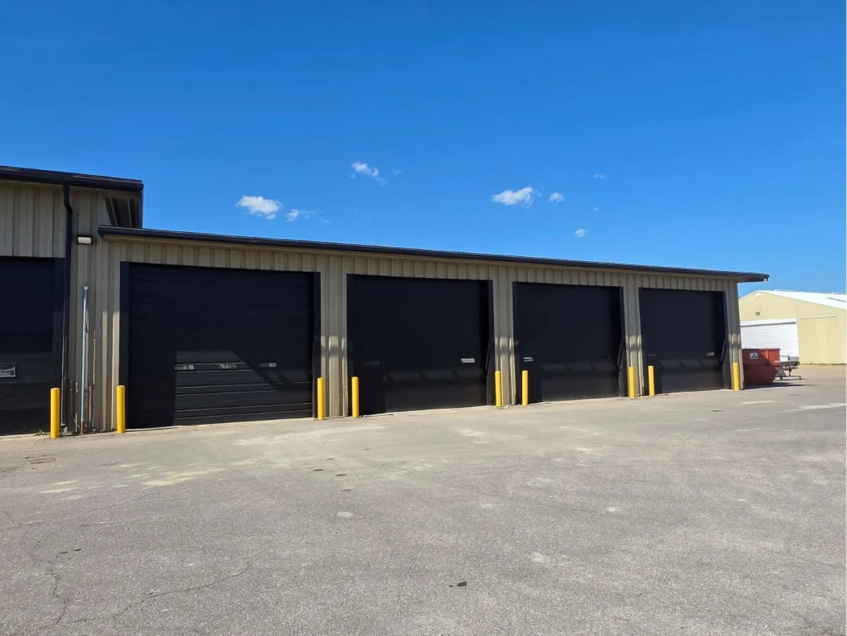 After: whole maintenance hangar side exterior · Le Sueur