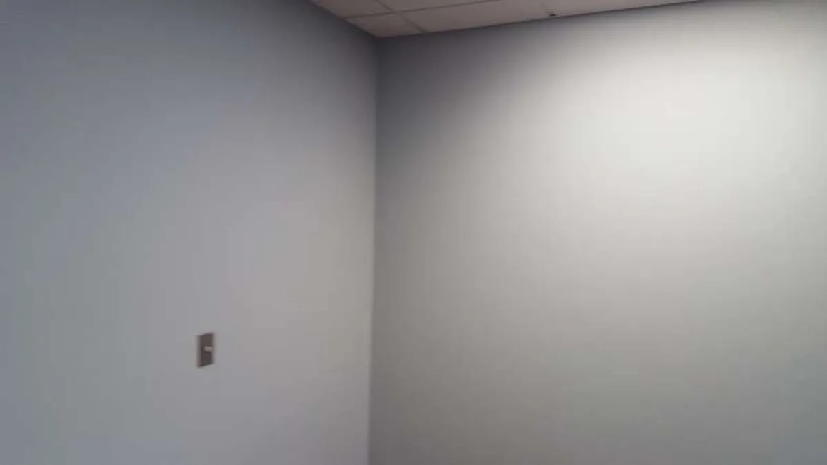 After: office wallpaper removed and walls repainted · New Hope