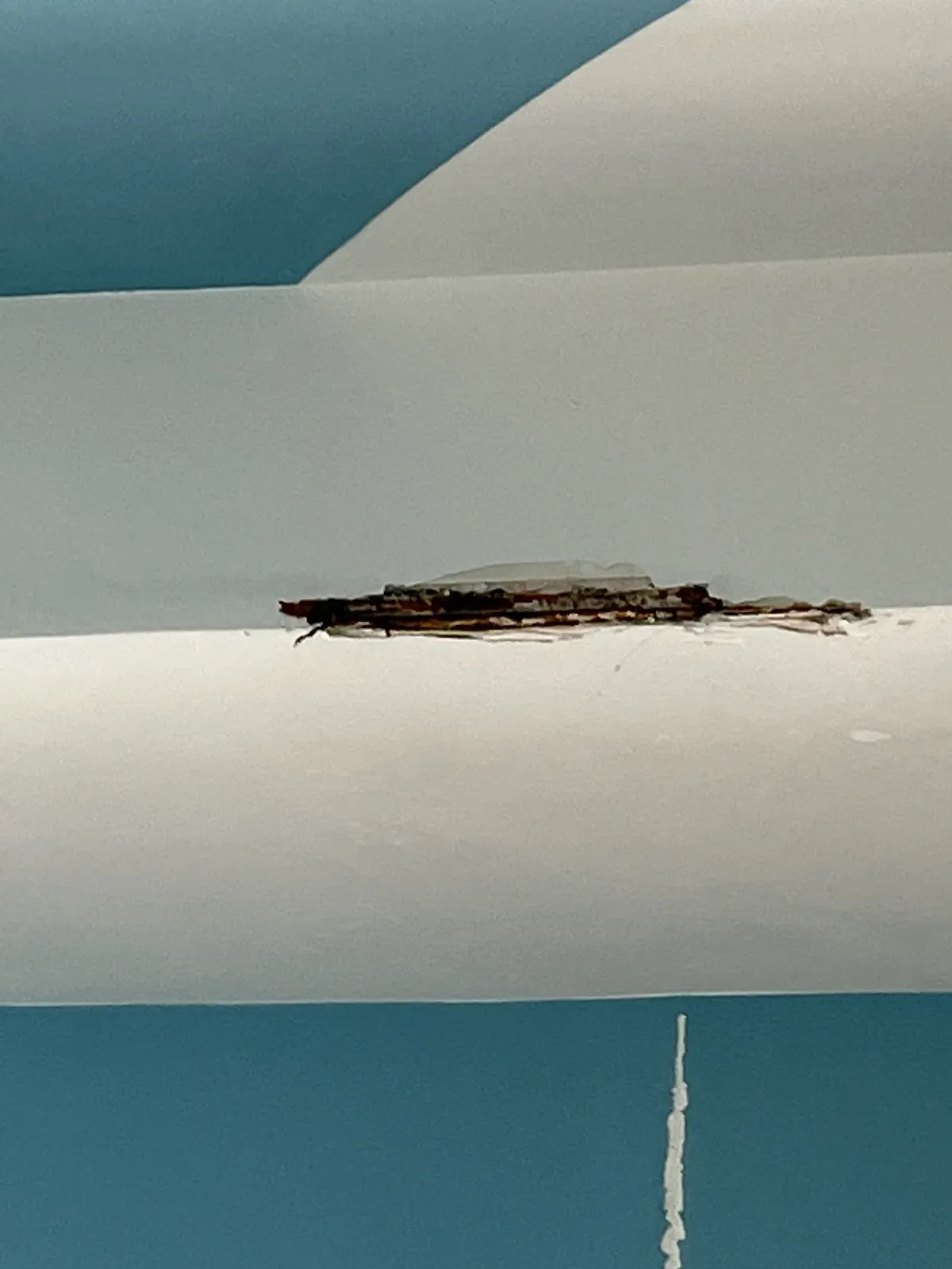 Before: damaged sheetrock beam · Woodbury