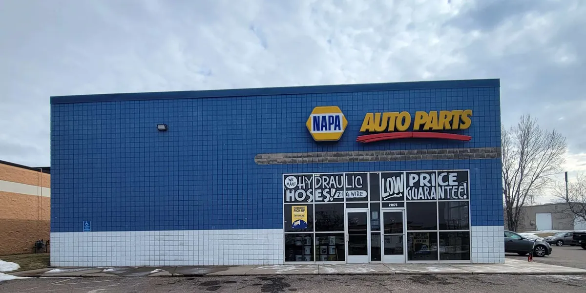 Before: NAPA storefront exterior · Hudson, WI.