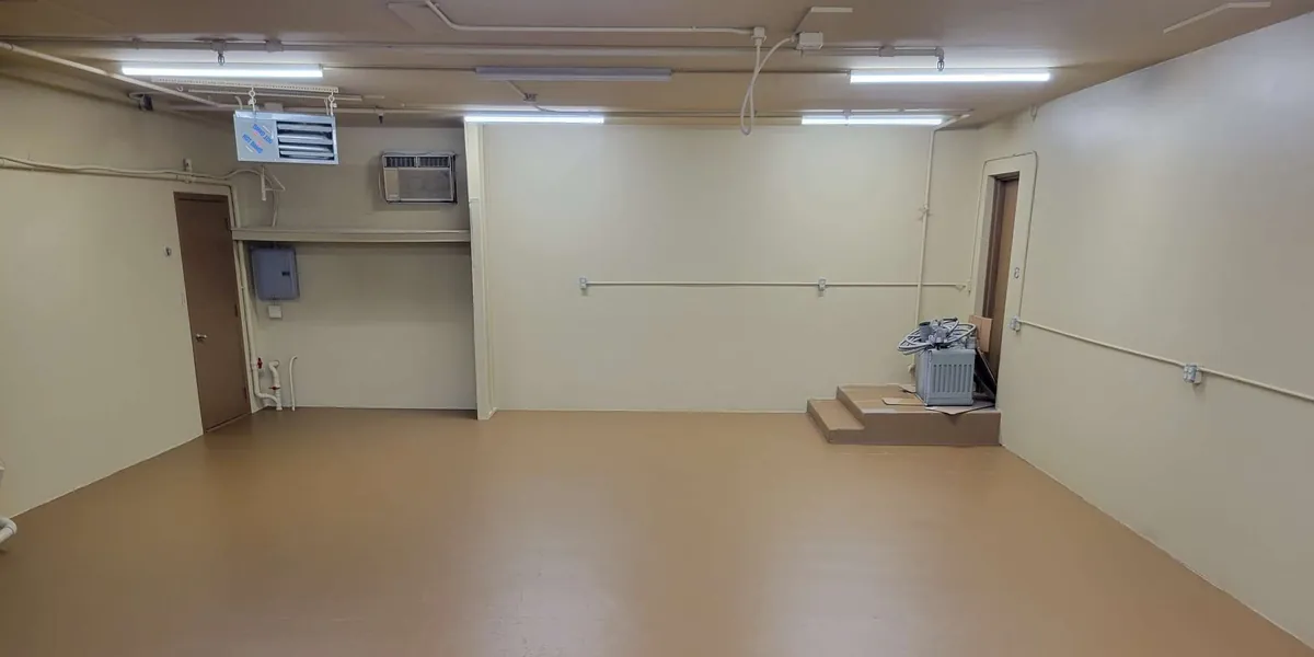 After: retail walls repainted and epoxy floor coated · St. Paul
